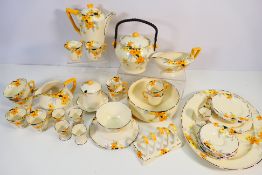 A quantity of Crown Ducal Sunburst pattern, Art Deco table wares, approximately 41 pieces.