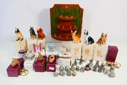 A mixed lot of boxed collectables to include: six miniature porcelain boxes/pill boxes with hinged