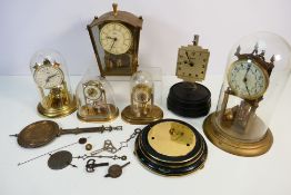 A collection of clocks, predominantly anniversary clocks, largest approximately 29 cm (h).