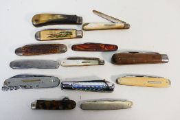 Knives - 12 pocket knives of various styles and grips.