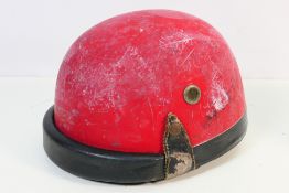 A vintage motorcycle racing helmet.