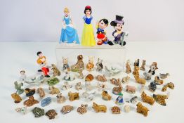 Lot comprising Wade Whimises, Beswick Cat Band figure and Disney character ceramic figures.