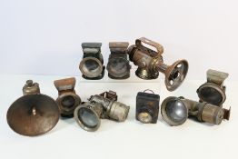A collection of vintage bicycle / motorcycle lamps to include Miller, Lucas and similar.