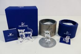 Swarovski - Three boxed animal figures comprising Cat Mother (standing) from the Peaceful