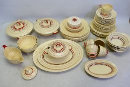 A quantity of Art Deco dinner and tea wares by Grey's Pottery, decorated in the Sunbuff pattern,
