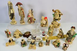 A collection of Chinese faux ivory traditional style figures,
