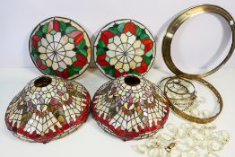 Two pairs of Tiffany style light shades, largest approximately 31 cm (d).