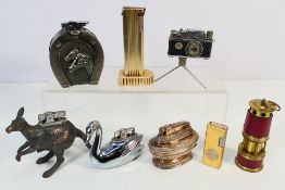 Lighters - Eight vintage lighters to include a camera lighter, a kangaroo lighter,