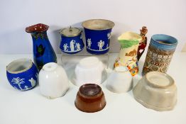 Lot to include ceramic jelly moulds,a relief moulded nursery rhyme jug, Three Little Pigs,