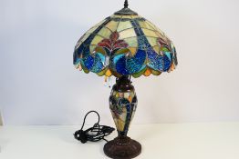 A Tiffany style lamp and shade, approximately 64 cm (h).