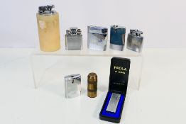 Lighters - Eight vintage lighters to include various lighters and a Paola lighter in case and other.