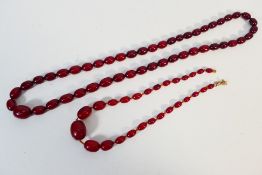 A cherry amber Bakelite necklace of graduated beads, approximately 82 cm (l),