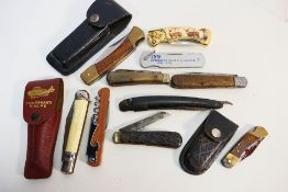 Knives - 9 Large-sized pocket knives of various styles and grips, two in belt sheaths.