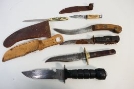 Knives - Six knives, three Bowie/survival style, one multi tool, a curved gardening tool,