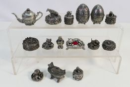 A collection of 15 pewter figures to include: trinket boxes,