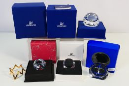 Swarovski - A collection of paperweights comprising a Harmony 2005 (with certificate),