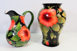 Blue Sky Pottery - A large vase decorated with hibiscus against a black ground and a jug of the