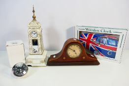 A collection of clocks to include a mantel clock, boxed wall clock in the form of a VW camper van,