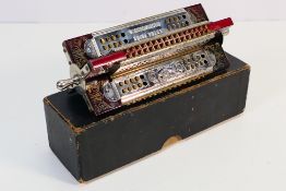 Harmonica - A boxed M Hohner quartet/paddle harmonica. Approximately 17 cm long excluding handles.