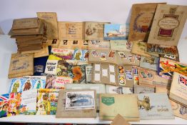 A collection of cigarette and tea card a