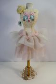 A decorative shop mannequin style display, approximately 66 cm (h).
