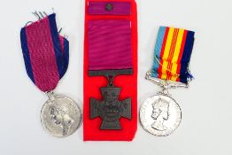 Three reenactment medals comprising a Waterloo Medal, Victoria Cross and Vietnam Medal.