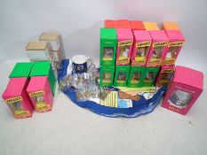 A quantity of Tetley related advertising collectibles to include Teafolk figures, teapot models,