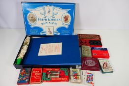 Vintage games to include Peter Rabbit's Race Game, various card games and similar.