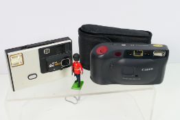 Lot to include a Canon EX camera, Kodak Disc 4000 and a Britain's Guardsman figure.