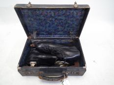 A pair of Manfield & Son black leather ice skates