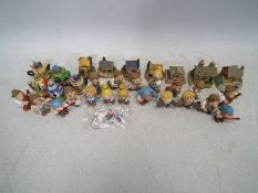 A quantity of Tetley Tea advertising items to include ten Tetley Tea Folk Band figures, keyring,