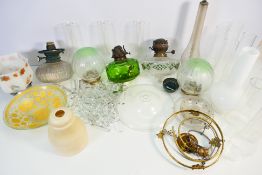 A collection of oil lamp parts, lustre drops and similar. [2].