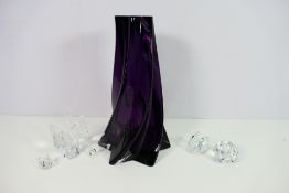 An amethyst glass vase of star section,