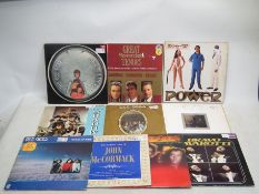 A collection of vinyl records to include The Bee Gees, Ice-T, Great Spanish Tenors and other.