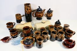 Two stoneware hot water bottles / bed warmers and a collection of tea wares. [2].