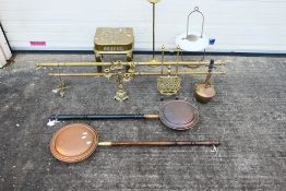A collection of metalware to include bed warmers, candelabra, floor standing ashtray and other.