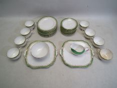 A collection of Aynsley tea wares, approximately 34 pieces,