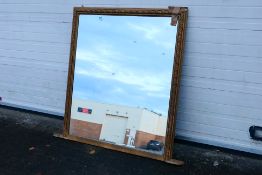 A large overmantel mirror, approximately 126 cm x 131 cm.