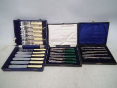 Cased flatware to include a set of silver handled butter knives,