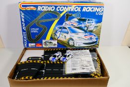 Majorette - A boxed radio controlled battery powered Peugeot 206 WRC slot car set # 480001.