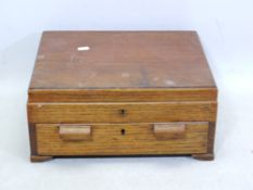 An oak box with lift up lid and single d