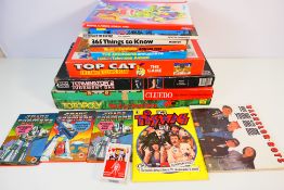A collection of board games and books to include: Cludo, Totopoly, Top Cat,