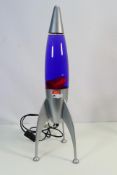 A large lava lamp in the form of a rocke