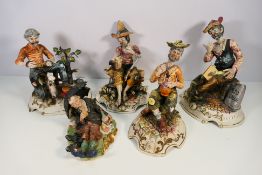 A collection of Capodimonte figures, largest approximately 39 cm (h).