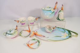 A collection of Franz Porcelain Butterfly pattern tea wares comprising two cups and saucers (wing