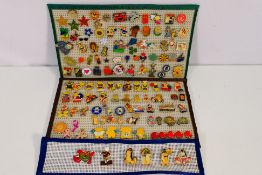 A collection of 100+ pin badges, mostly charity includes enameled examples.