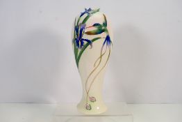 A large Franz Porcelain vase decorated in the Hummingbird pattern numbered # FZ00127 to the base,