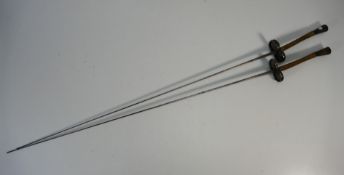 An antique pair of G Pion, Paris fencing foils, each stamped with makers mark and lion,