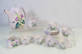 A Carlton Ware coffee set decorated with convolvulus (morning glory), printed marks to the base,
