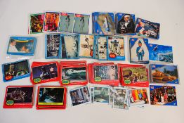 A collection of various trade cards to include Star Wars, Thunderbirds,